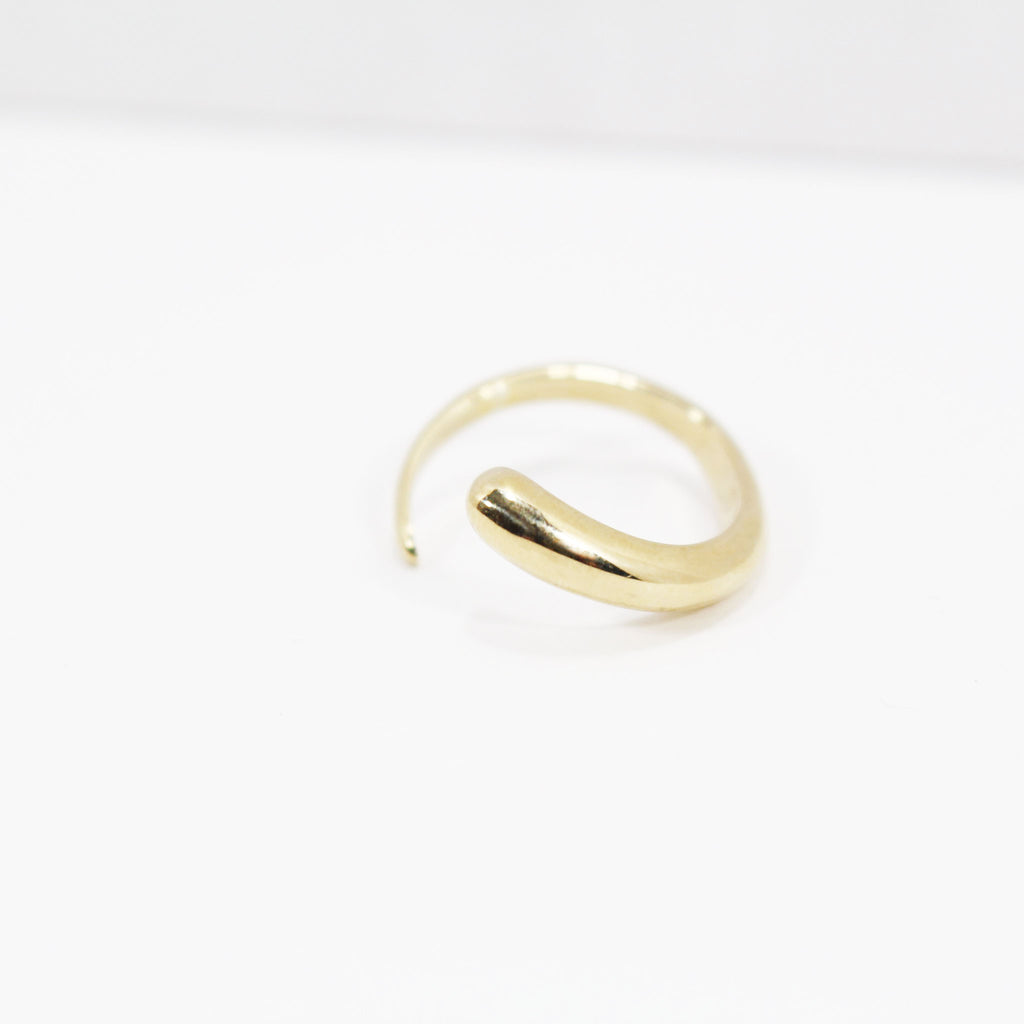 Delicate gold brass ring with tapered design.