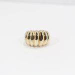 Front view of ridged texture on gold ring.