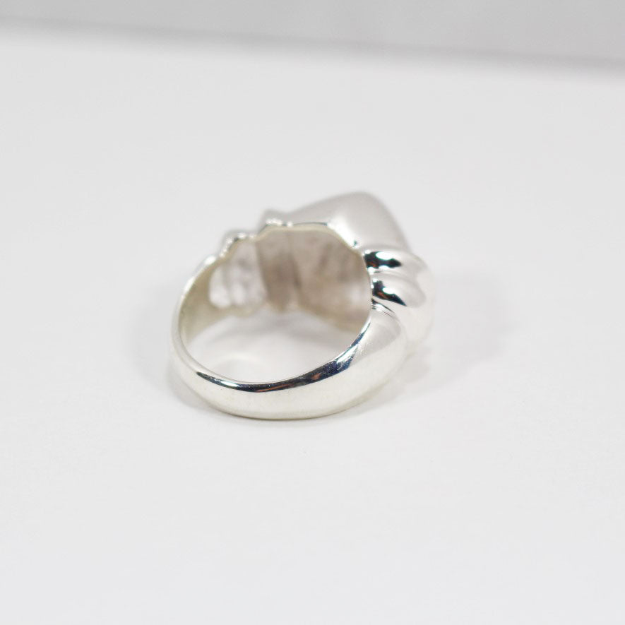 Back view of sculptural sterling silver ring.